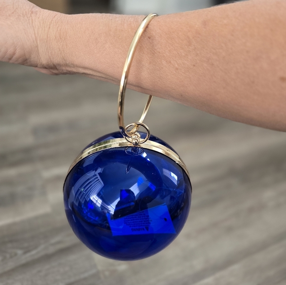 Cobalt blue wristlet round ball, gold trim and gold crossbody chain. - Picture 5 of 9